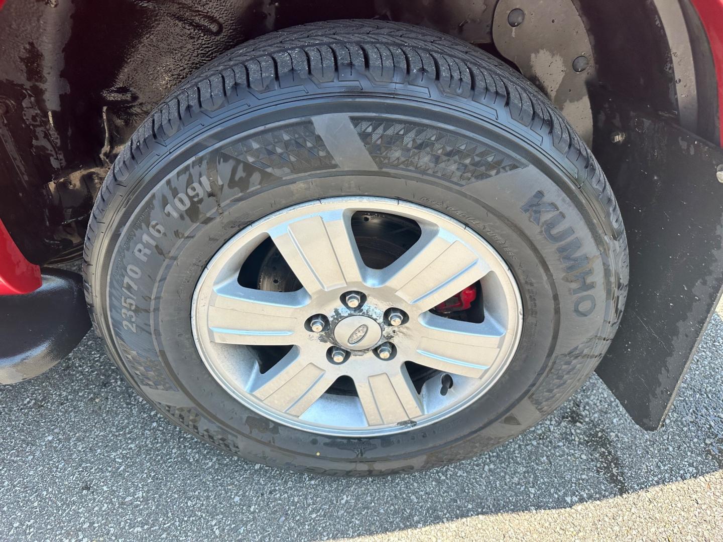 2009 Red /black Ford Explorer XLT (1FMEU73E89U) with an 4.0L V6 engine, 5-Speed Automatic transmission, located at 11115 Chardon Rd. , Chardon, OH, 44024, (440) 214-9705, 41.580246, -81.241943 - This 2009 Ford Explorer is a reliable and capable SUV, offering a 4.0L V6 engine paired with a 5-speed automatic transmission and full-time 4WD system. With a 3,500-pound towing capacity, it's suitable for moderate hauling needs. Additionally, the power driver's seat provides comfort and convenience - Photo#10